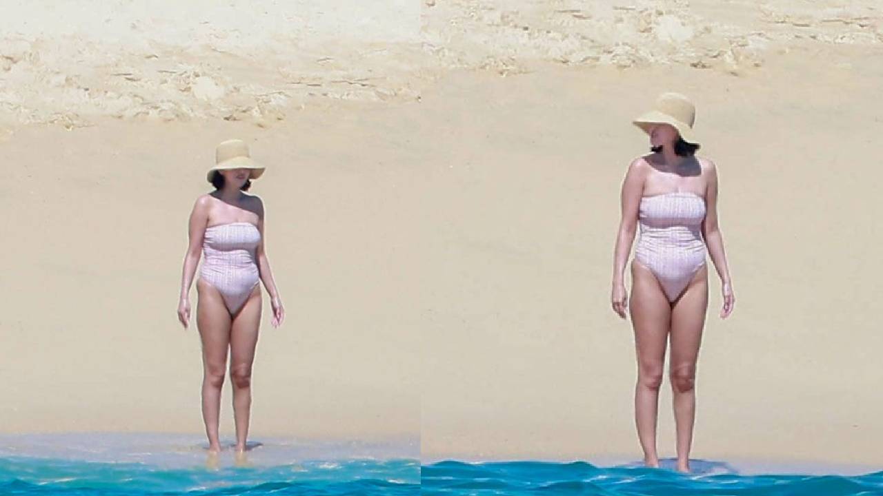 Selena Gomez tampil santai dengan swimsuit pink saat menikmati suasana pantai di Los Cabos.